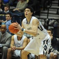 A first for everything: George Washington freshman forward Yuta Watanabe takes a shot in Wednesday\'s game against Davidson College. Watanabe made his first collegiate start in the Colonials\' 65-63 loss.  | JAPAN BASKETBALL ASSOCIATION