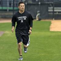 Back to business: Masahiro Tanaka works out at the Yankees\' minor league complex in Tampa, Florida, on Tuesday. | AP