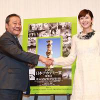 It\'s a deal: Actors Toshiyuki Nishida and Yoko Maki &#8212; presenters for the 38th Japan Academy prizes &#8212; shake hands at a press conference ahead of the ceremony. The Japan Academy has recently come under fire from director Takeshi Kitano for its biases. | &#169; 2015 \"SAIHATE NITE\" SEISAKU IINKAI