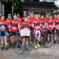 Red sweater day: The Knights in White Lycra are pictured before last year’s long-distance charity ride from Tokyo to Minamisanriku. Robert Williams is fifth from left. In lycra and online, foreigners are doing their bit for Tohoku