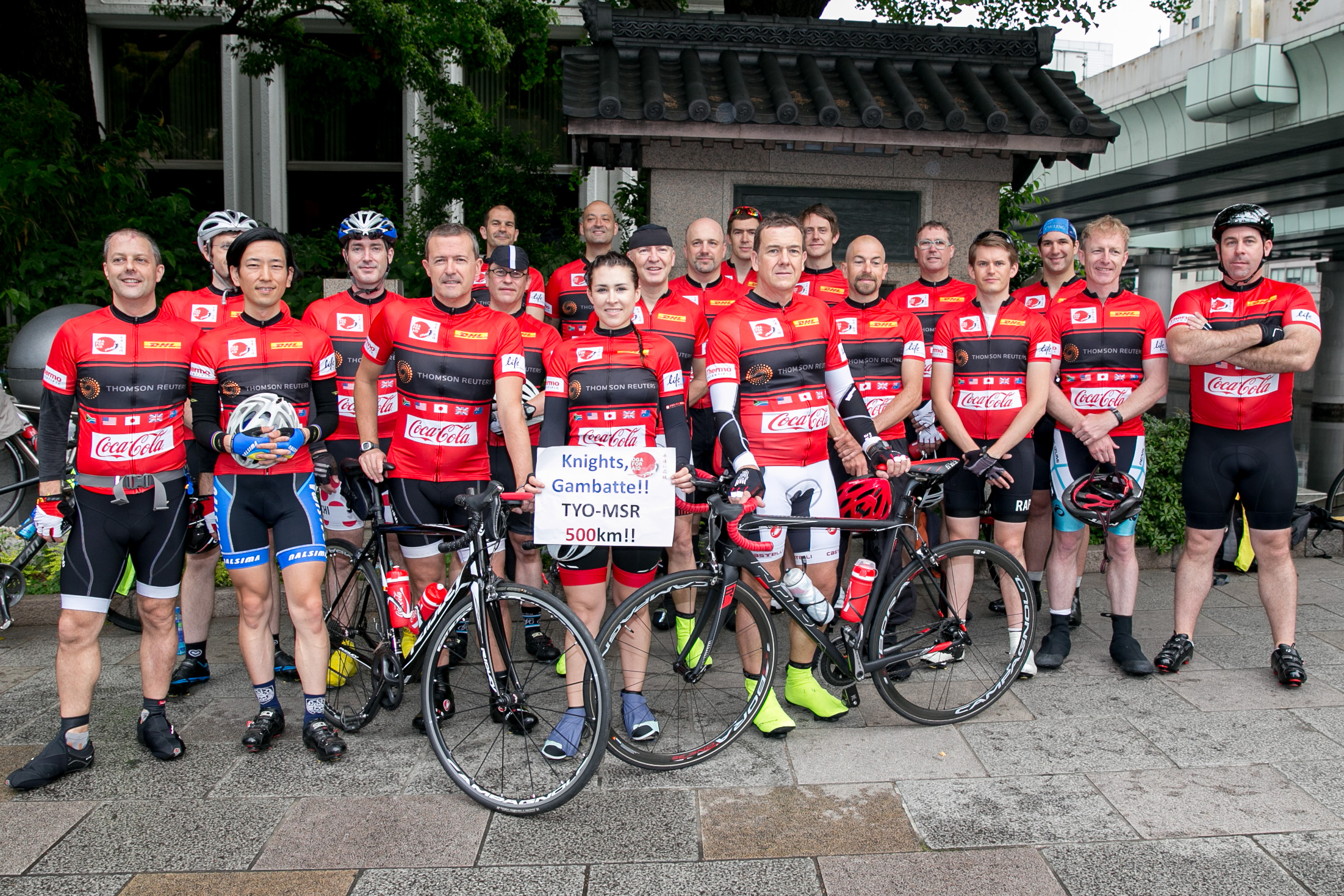 Red sweater day: The Knights in White Lycra are pictured before last year's long-distance charity ride from Tokyo to Minamisanriku. Robert Williams is fifth from left. |  IVAN DOHERTY