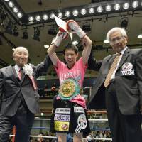 Still the champ: Momo Koseki dons her WBC atomweight championship belt after a second-round knockout of challenger Aisah Alico on Thursday in Tokyo. | KYODO