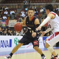 Drive and dish: B-Corsairs guard Kenji Yamada, seen in a file photo from a May 2013 playoff game, had a team-high seven assists in Friday\'s game against the Broncos at Yokohama Cultural Gymnasium. Saitama defeated Yokohama 92-79.  | YOSHIAKI MIURA