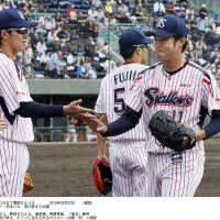 Baby steps: Tokyo Yakult\'s Yoshinori Sato leaves the mound after pitching two innings of the Swallows\' 3-0 preseason win over the Fighters in Urasoe, Okinawa Pref., on Sunday. | KYODO