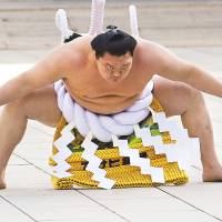 Man of the people: Hakuho scheduled to be given the equivalent of Japan\'s People\'s Honor Award in his native Mongolia. | REUTERS