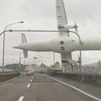 An image from a motorist\'s dashboard camera posted on Twitter shows a Taiwanese TransAsia Airways plane stalling over a highway close to Taipei\'s downtown airport on Wednesday, moments before it crashed into a shallow river. At least 15 of the 58 people aboard were killed, but several survived by clambering onto the submerged wreckage. | REUTERS