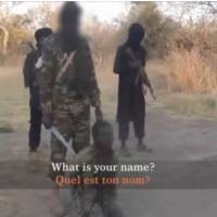 A video screenshot shows Boko Haram militants forcing a man accused of spying to confess. | REUTERS