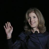U.S. Ambassador to Japan Caroline Kennedy waves to the audience before she delivers opening remarks during JFK International Symposium at Waseda University in Tokyo on Wednesday. | AP