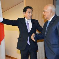 Foreign Minister Fumio Kishida escorts Ricardo Cabrisas, vice president of Cuba\'s Council of Ministers, at the Foreign Ministry in Tokyo on Monday. | KYODO