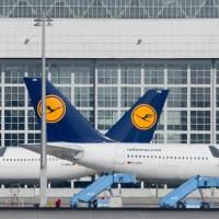 Lufthansa planes park at the airport in Munich Thursday. Thousands of international travelers were stranded Thursday as a strike by Lufthansa pilots was extended to long-haul flights, and Germany\'s largest airline said it was preparing for even more cancellations on Friday. | AP