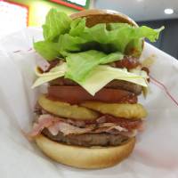 Mos Burger\'s Tokyo Tower Burger went on sale on Friday exclusively at its store inside the 333-meter-high landmark tower. | KAZUAKI NAGATA