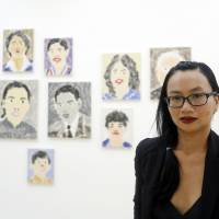 Vietnam War survivor Quynh Pham poses in her art gallery Galerie Quynh in Ho Chi Minh City on Sunday. | REUTERS