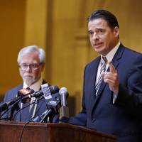 Indiana Senate Democratic Leader Tim Lanane (left) and Indiana House Democratic Leader Scott Pelath call for the repeal of the Indiana Religious Freedom Restoration Act during a press conference at the Statehouse in Indianapolis on Monday. Republican legislative leaders say they are working on adding language to a new state law to make it clear that it doesn\'t allow discrimination against gays and lesbians. | AP