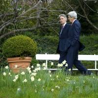 U.S. Secretary of State John Kerry talks to British Foreign Secretary Philip Hammond in the Olympic Garden next to the Beau Rivage Palace Hotel in a break during Iran nuclear program talks in Lausanne, Switzerland, on Monday. Iran and major powers were struggling on Monday to reach a preliminary nuclear accord as \"gloom\" set in, with both sides sticking to their positions a day before a self-imposed deadline. | REUTERS