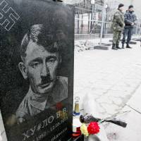 A mock funeral plate depicting Russian President Vladimir Putin as Adolf Hitler is being used as part of a \"Funeral of Putin\" performance in a front of the Russian Embassy in Kiev  on Sunda. A wave of savage mockery broke over Putin across the Internet on Friday, sparked by days of absence from public view, despite official insistence it was business as usual in the Kremlin. The inscription on the plate reads  \"D#head V.V.,  7.10.1952 12.03.2015, Vova, don\'t fail us. PTN FOF.\" | REUTERS