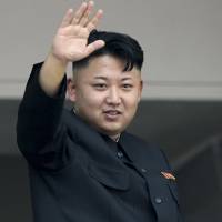 North Korean leader Kim Jong Un waves to spectators and participants of a mass military parade celebrating the 60th anniversary of the Korean War armistice in Pyongyang in July 2013. The leader of North Korea is among 26 world leaders who have accepted invitations to Moscow to take part in celebrations marking the 70th anniversary of the Soviet Union\'s victory over Nazi Germany, Russian Foreign Minister Sergey Lavrov said Tuesday. | AP