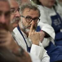 Chef Massimo Bottura of Italy gestures as he sits with other chefs from some of the world\'s best-rated restaurants during a meeting in San Sebastian, northern Spain, on Tuesday. They are trying to draw attention to what they hope is a simple solution to the threat facing many of the larger fish species that overfishing has pushed to near collapse. They want people to eat smaller fish. | AP