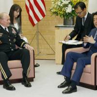 Prime Minister Shinzo Abe and U.S. Gen. Martin Dempsey, chairman of the Joint Chiefs of Staff, hold talks on Wednesday at Abe\'s office in Tokyo. | KYODO