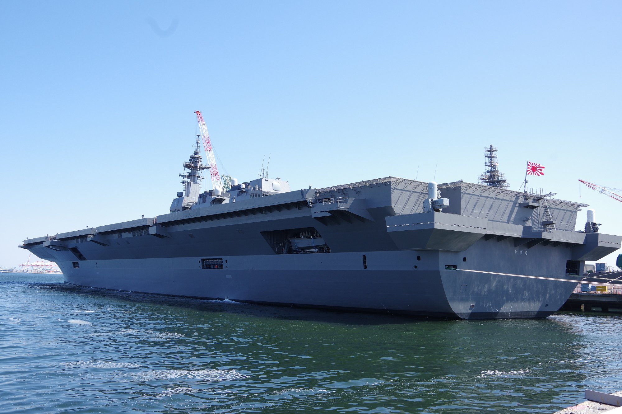 The Izumo 'helicopter destroyer' is docked in Yokohama on Wednesday after a ceremony in which shipbuilder Japan Marine United Corp. handed the 19,500 ton-warship over to the Maritime Self-Defense Force. | REIJI YOSHIDA