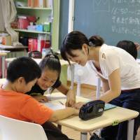 Elementary school students study at an after-school facility run by NPO Katariba in Onagawa, Miyagi Prefecture. | COURTESY OF KATARIBA