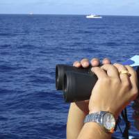 A crewman from the Vietnamese coast guard ship 8003 looks out at sea as Chinese coast guard vessels give chase to Vietnamese ships that came close to the Haiyang Shiyou 981, known in Vietnam as HD-981, oil rig in the South China Sea last July 15. Seventy years after its Imperial forces were kicked out of the South China Sea, Japan is quietly moving back into the region, forging security ties with the Philippines and Vietnam as both Southeast Asian nations try to cope with China\'s territorial ambitions. | REUTERS