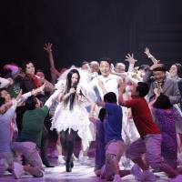 Top girl: Idol Ichie Ichigo (played by Eri Fukatsu) revels in her wedding to egg-athlete Hirafu Abe (Satoshi Tsumabuki, in white) in Hideki Noda’s “Egg.” Noda's 'Egg' scrambles understanding