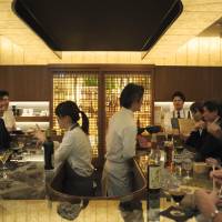 Close for comfort: Patrons gather at Takazawa Bar in Tokyo\'s Akasaka district. | YUJI HONDA