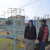 Kyoto calls: German duo Franz Hoefner and Harry Sachs observe the site near Kyoto Station they hope to transform for the Parasophia contemporary art and culture event that begins this weekend. | J.J. O\'Donoghue