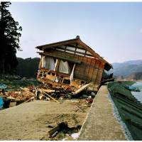 Can\'t look away: A photograph of a wooden home washed up on a beach after the 3/11 tsunami, in Naoya Hatakeyama\'s photo book \"Kesengawa.\" | NAOYA HATAKEYAMA / KAWADE SHOBO SHINSHA