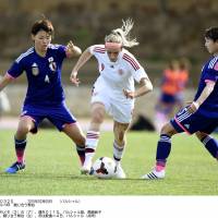 Learning curve: Japan\'s Saki Kumagai (left) and Aya Sameshima (right) try to stop a Danish attack during Japan\'s 2-1 defeat to Denmark at the Algarve Cup on Wednesday. | KYODO