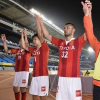 Notice me: Nagoya\'s Kengo Kawamata (right) celebrates with teammates after Grampus\' win over Frontale on Wednesday. | KYODO