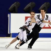 One and done: Cathy and Chris Reed perform their ice dance short program at the World Figure Skating Championships on Wednesday in Shanghai. The Reeds failed to advance to the free dance. | AFP-JIJI
