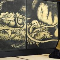 A digitally produced replica of Soga Shohaku\'s 1763 painting, \"Unryu-zu,\" is shown to the media Friday at Tenryuji Temple in Kyoto. With the original housed in the Museum of Fine Arts, Boston, it took about a year for Canon Inc. to produce the replica. | KYODO