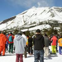 Mourners pray silently Friday in the village of Otaki, Nagano Prefecture, six months after the surprise eruption of Mount Ontake killed at least 57 hikers and left six others missing in Japan\'s deadliest volcanic disaster in postwar memory. | KYODO