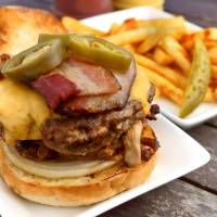 A hand-ground cheeseburger topped with smoked bacon at Magical Animal at Pop-up@Aoyama | DON KENNEDY