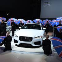 Dancing girls perform at the Jaguar media conference Wednesday during the New York Auto Show at the Jacob Javits Center in New York. | AFP-JIJI