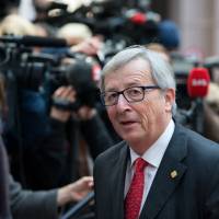 European Commission President Jean-Claude Juncker arrives for a European Union leaders\' summit in Brussels in February. The annual summit expected in May in Tokyo will be the first since Juncker and European Council President Donald Tusk took office. | BLOOMBERG