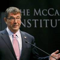 U.S. Secretary of Defense Ash Carter waits to speak, Monday at the the McCain Institute at Arizona State University in Tempe. The Obama administration is opening a new phase of its strategic \"rebalance\" toward Asia and the Pacific by investing in high-end weapons such as a new long-range stealth bomber, refreshing its defense alliance with Japan and expanding trade partnerships, Carter said Monday. | AP