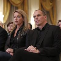 Greek Finance Minister Yanis Varoufakis and his wife, Danae Stratou, attend a banking conference in Athens on April 21. | REUTERS