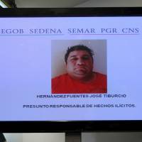 A photo of Jose Tiburcio Hernandez Fuentes is displayed during a news conference by Mexican government security spokesman Alejandro Rubido (not pictured) at the Interior Ministry in Mexico City on Saturday. | REUTERS