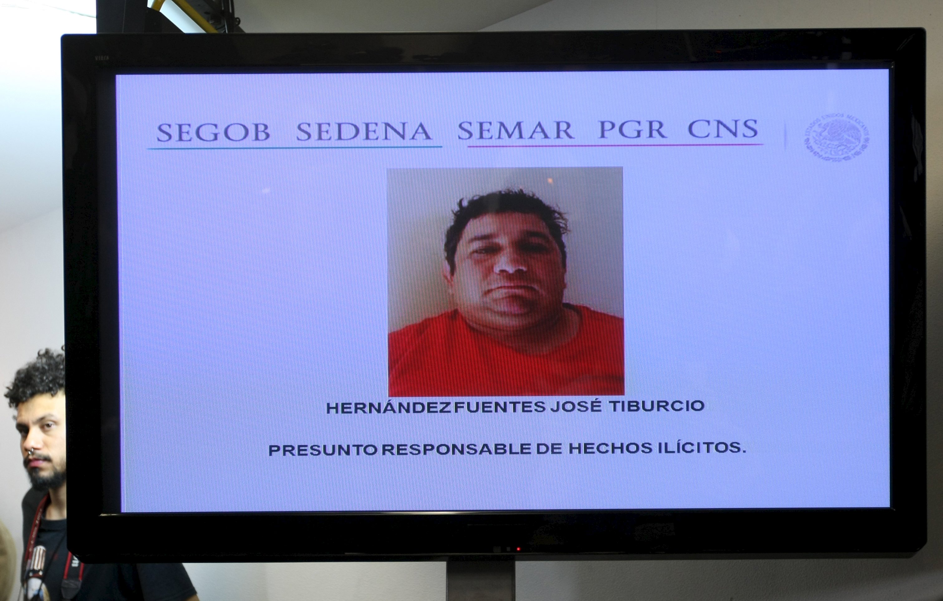 A photo of Jose Tiburcio Hernandez Fuentes is displayed during a news conference by Mexican government security spokesman Alejandro Rubido (not pictured) at the Interior Ministry in Mexico City on Saturday. | REUTERS