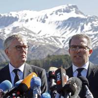Lufthansa Chief Executive Carsten Spohr (right) and Germanwings Managing Director Thomas Winkelmann hold a news conference near the memorial for the victims of the air disaster in the village of Le Vernet, near the crash site of the Germanwings Airbus A320 in the French Alps, on Wednesday, but apparently sidestepped questions about why co-pilot Andreas Lubitz, who deliberately crashed the jet, was allowed to fly, despite being grounded by his condition. | REUTERS
