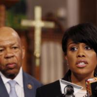 Baltimore Mayor Stephanie Rawlings-Blake speaks as Democratic U.S. Rep. Elijah Cummings looks on during a Sunday news conference on the demonstrations for Freddie Gray, who died following an arrest by the Baltimore police department. | REUTERS