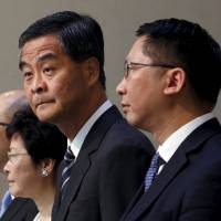 Hong Kong Chief Executive Leung Chun-ying (second from right) stands beside Secretary for Constitutional and Mainland Affairs Raymond Tam (left), Chief Secretary Carrie Lam (second from left) and Secretary for Justice Rimsky Yuen, ahead of a Legislative Council meeting in the city on Wednesday. | REUTERS