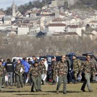 Soldiers leave after a briefing and before heading to the Germanwings crash site Thursday in Seyne-les-Alpes, France. Investigators believe co-pilot Andreas Lubitz intentionally crashed the A320 into a mountainside, killing 150 people. Special mountain troops searching the area for personal belongings also found the second black box flight recorder. | AP