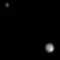 This image taken by the New Horizons spacecraft shows Pluto and its largest moon, Charon. | NASA / JOHNS HOPKINS UNIVERSITY APPLIED PHYSICS LABORATORY / SOUTHWEST RESEARCH INSTITUTE / REUTERS
