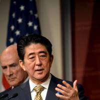 Prime Minister Shinzo Abe answers questions from the crowd at Harvard University\'s John F. Kennedy School of Government in Cambridge, Massachusetts on Monday. | REUTERS