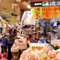 Grocers selling ethnic foodstuffs are crowded inside Ameyoko Center Building near JR Ueno Station in Tokyo. | YOSHIAKI MIURA