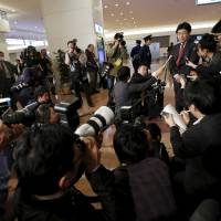 Former Seoul bureau chief of the Sankei Shimbun Tatsuya Kato speaks to the media upon his arrival Tuesday at Haneda international airport in Tokyo. South Korea lifted the travel ban against Kato, who stands accused in the South of defaming South Korean President Park Geun-hye. Sankei ex-Seoul bureau chief 'relieved' to be back in Japan