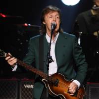 Paul McCartney performs at Nippon Budokan Hall in Tokyo on Tuesday night. The concert marked McCartney\'s first return to the venue since the Beatles played there in 1966. | KYODO